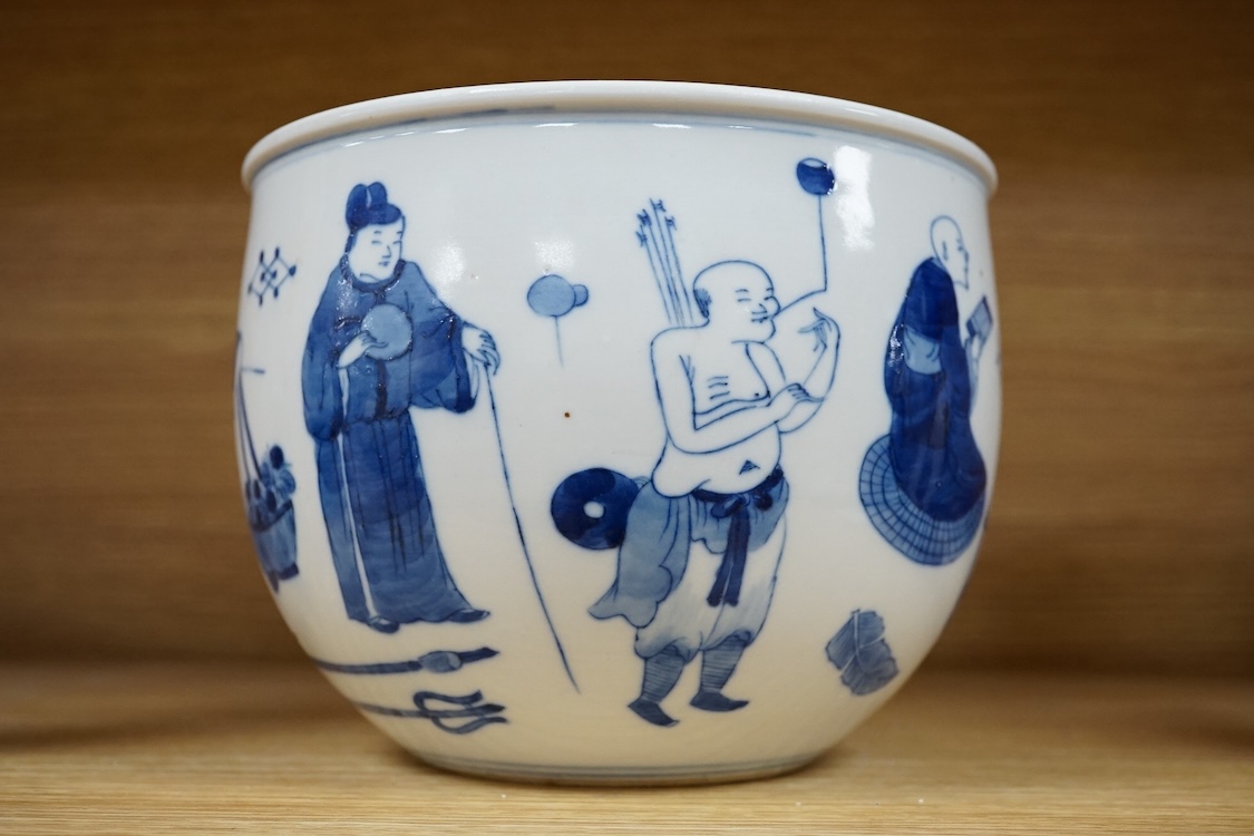 A small Chinese blue and white jardiniere painted with figures at various pursuits, 19cm in diameter